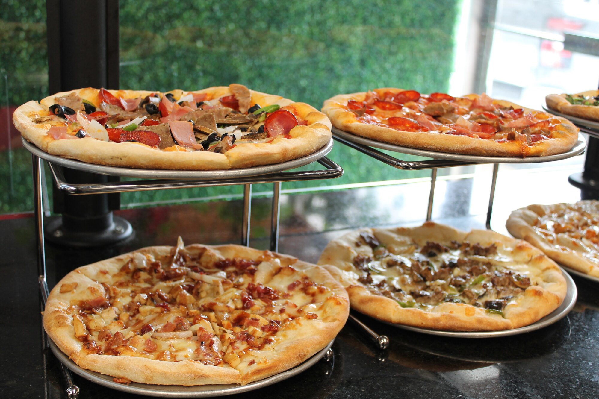 Pizzaiolo at work in the Bussin Pizza kitchen